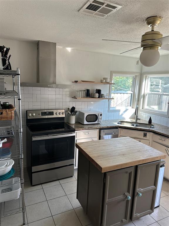 3204 North 24th Street Waco, TX 76708 - Photo 11 of 16 a kitchen with a stove a sink and a stove