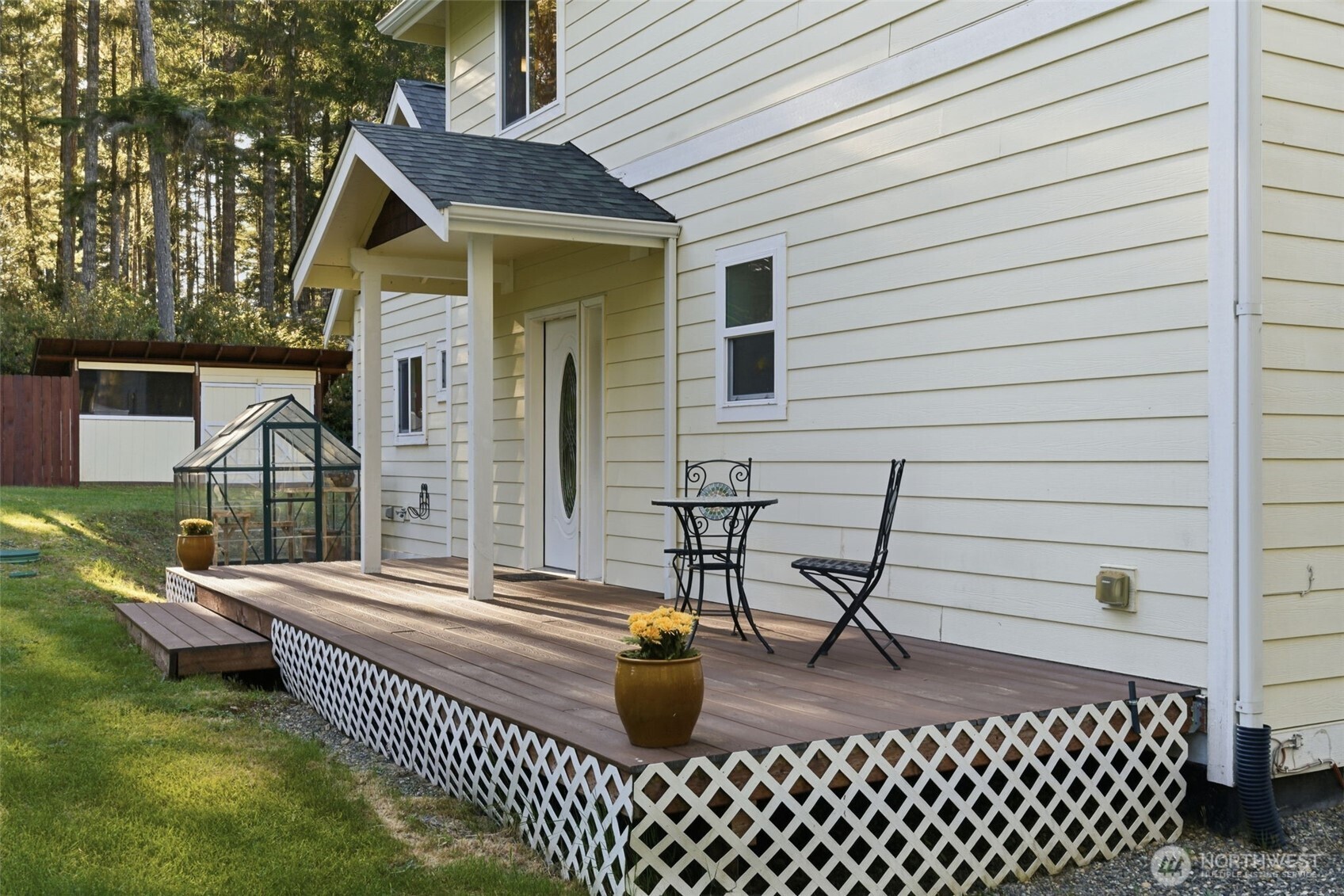 6971 Northeast Tahuya Blacksmith Road Belfair, WA 98528 - Photo 5 of 38 a front view of a house with patio