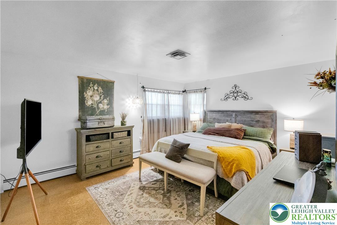 5747 Kernsville Road Orefield, PA 18069 - Photo 27 of 56 a bedroom with a bed and furniture