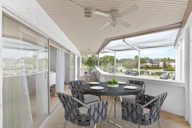a dining room with furniture and window