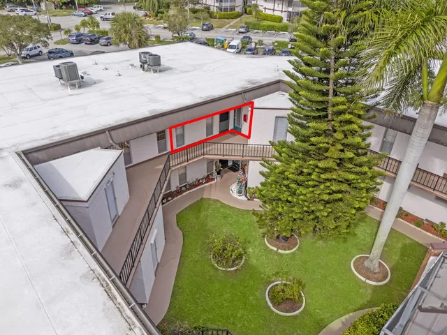a aerial view of a house with a swimming pool