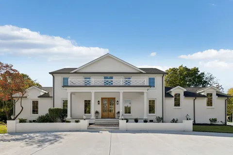 front view of a house with a view of a building