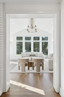 a bathroom with a granite countertop sink and a window