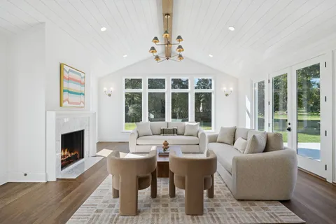 an entryway with a window and wooden floor