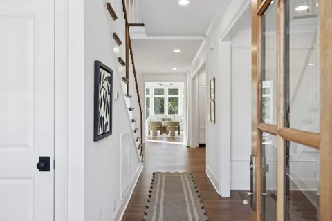 a dining room with furniture and wooden floor