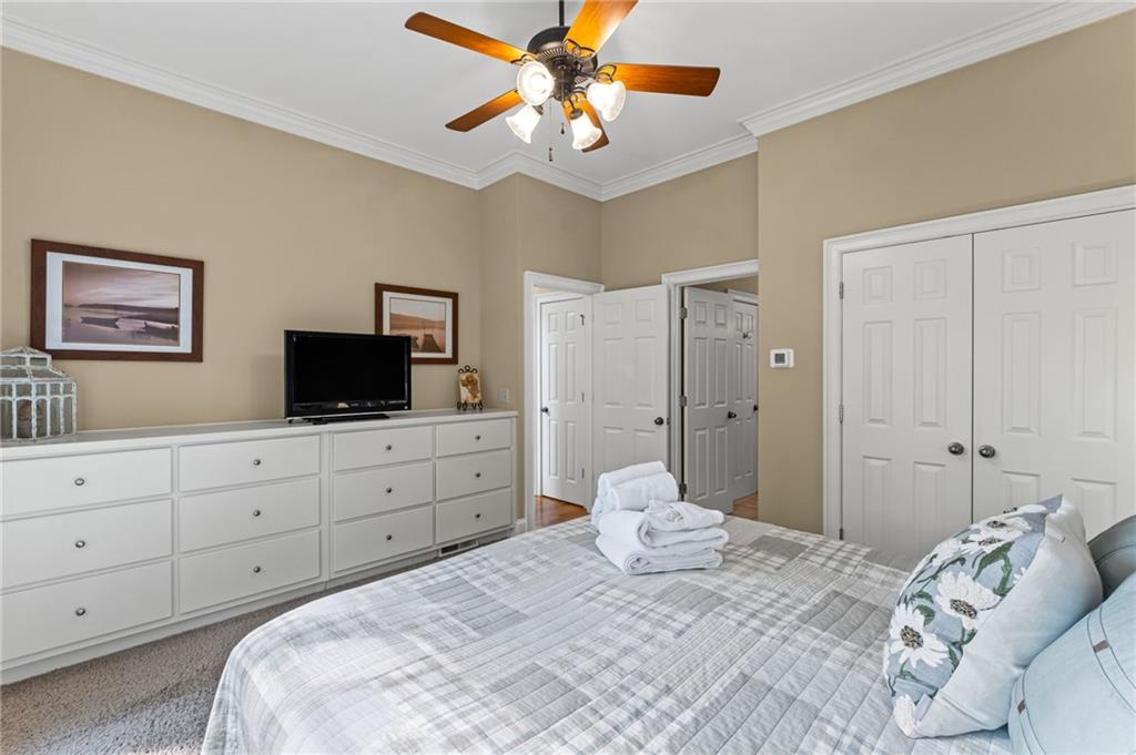 23 Laurel Ridge Trail Big Canoe, GA 30143 - Photo 15 of 36 a bedroom with a bed and a tv