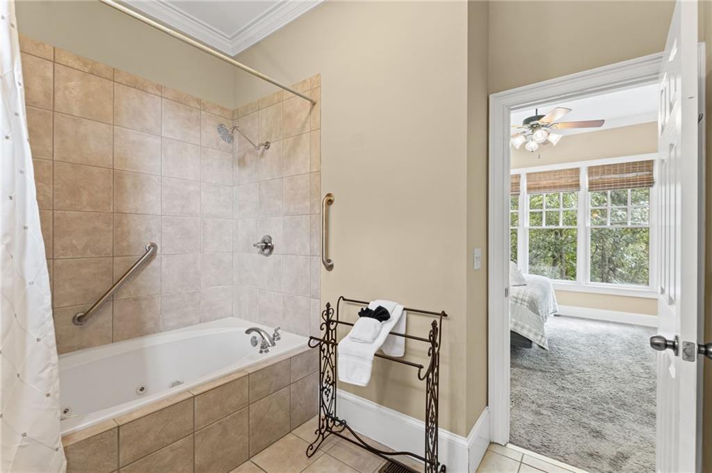 23 Laurel Ridge Trail Big Canoe, GA 30143 - Photo 17 of 36 a bathroom with a bathtub and a shower