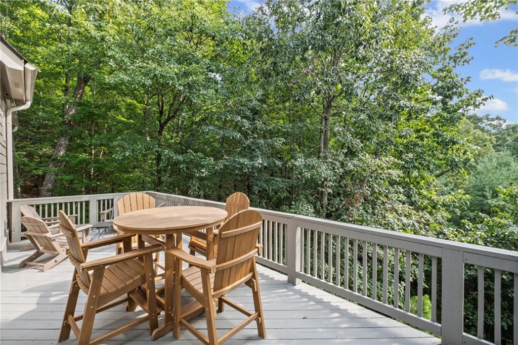 23 Laurel Ridge Trail Big Canoe, GA 30143 - Photo 21 of 36 a view of balcony with furniture and trees