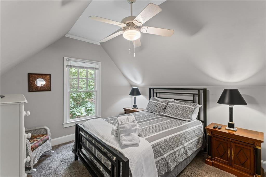 23 Laurel Ridge Trail Big Canoe, GA 30143 - Photo 24 of 36 a bedroom with a bed and a chandelier