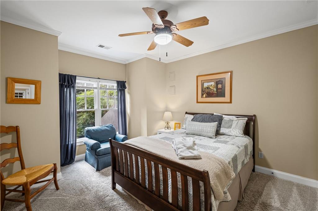 23 Laurel Ridge Trail Big Canoe, GA 30143 - Photo 28 of 36 a bedroom with a bed a couch and a window