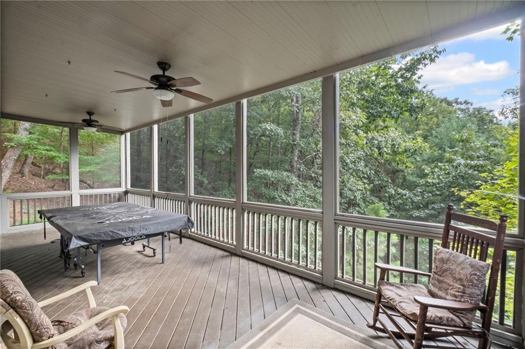 23 Laurel Ridge Trail Big Canoe, GA 30143 - Photo 35 of 36 a dining room with furniture large windows and wooden floor