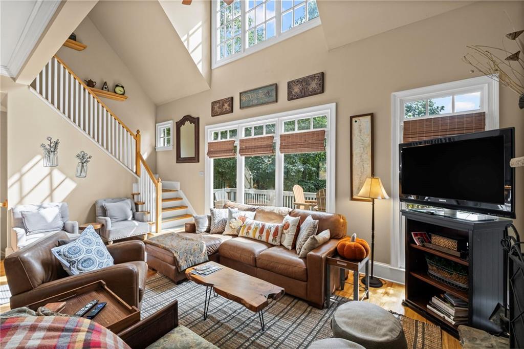 23 Laurel Ridge Trail Big Canoe, GA 30143 - Photo 9 of 36 a living room with furniture and a flat screen tv
