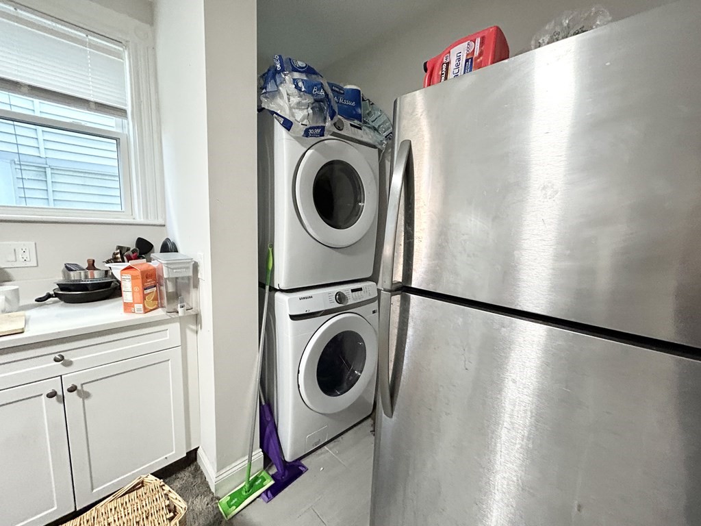 9 Mt Pleasant Avenue, Unit 2 Boston, MA 02119 - Photo 2 of 9 a utility room with dryer and washer
