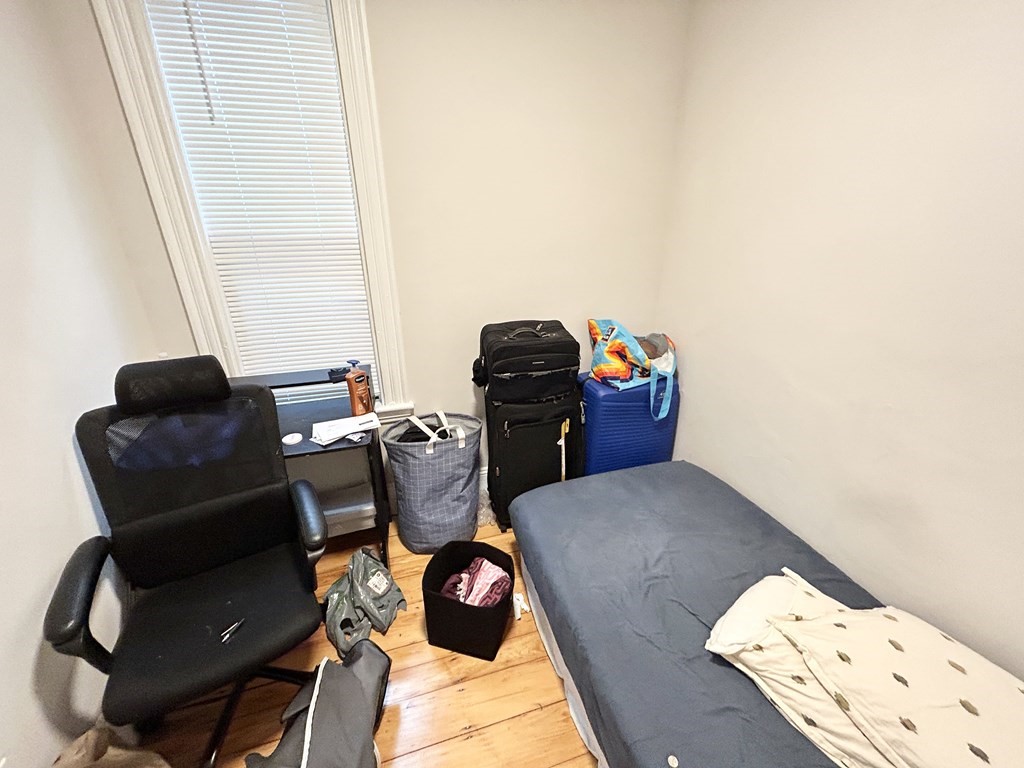 9 Mt Pleasant Avenue, Unit 2 Boston, MA 02119 - Photo 5 of 9 a view of a workspace with furniture and a window