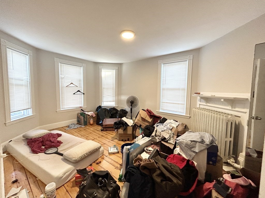 9 Mt Pleasant Avenue, Unit 2 Boston, MA 02119 - Photo 6 of 9 a living room with furniture and a window