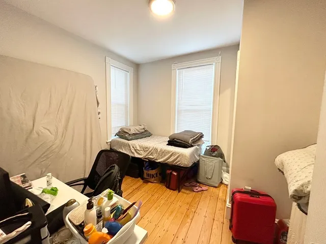 a bedroom with a bed and gym equipment