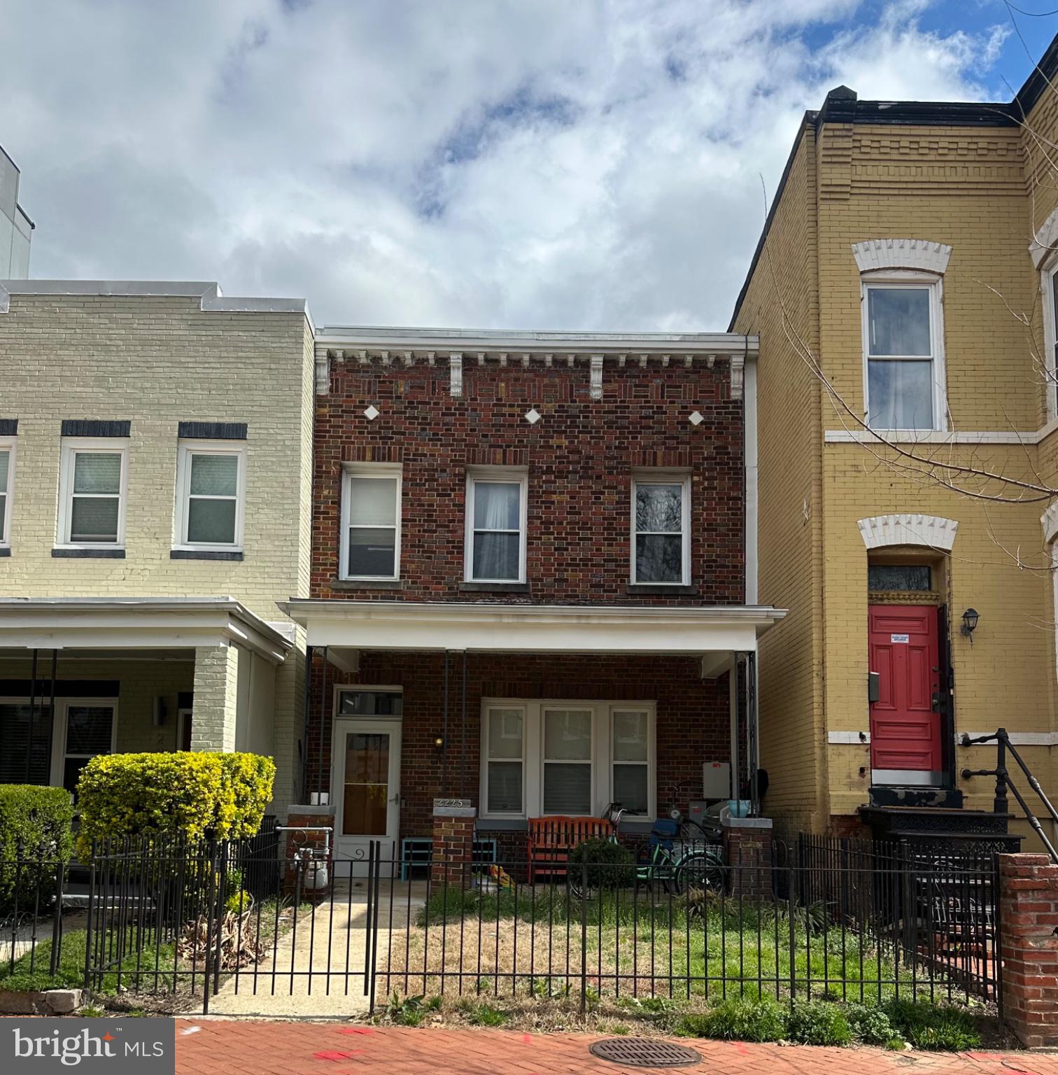 2225 12th Street Northwest Washington, DC 20009 - Photo 2 of 9 a front view of a house with a garden