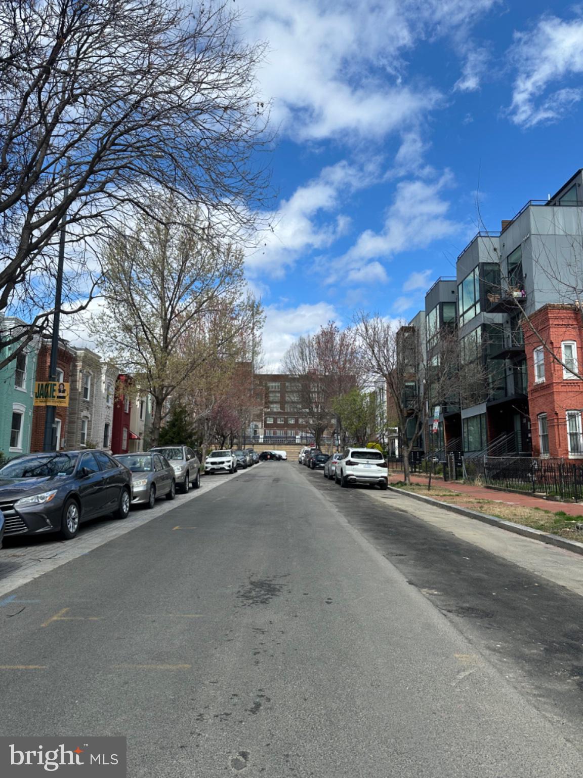 2225 12th Street Northwest Washington, DC 20009 - Photo 4 of 9 a city street lined with buildings and cars