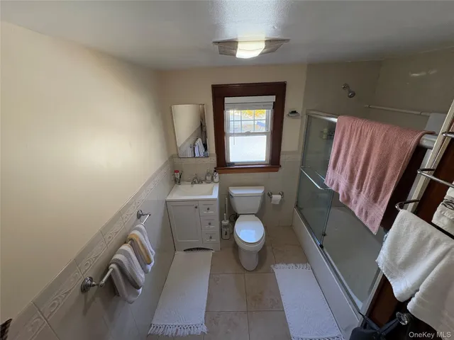 a view of a bathroom with a sink and a mirror