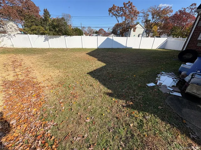 a view of a yard with a tree