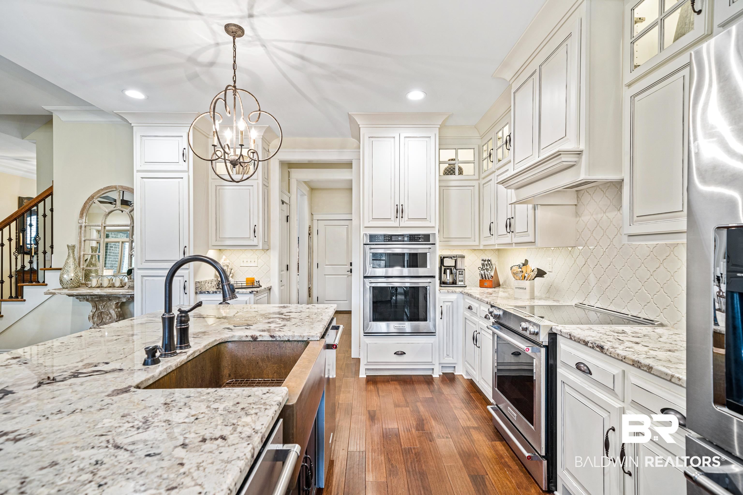 36784 Legacy Way Bay Minette, AL 36507 - Photo 16 of 57 Kitchen with white cabinetry, decorative light fixtures, and stainless steel appliances