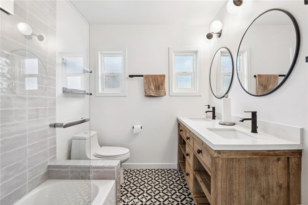 1448 Lemon Avenue Long Beach, CA 90813 - Photo 11 of 16 a bathroom with a sink a toilet and a mirror