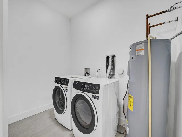 a bed room with a bed and a wall painting