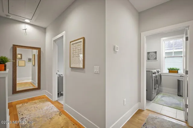 a view of room with window and hardwood floor