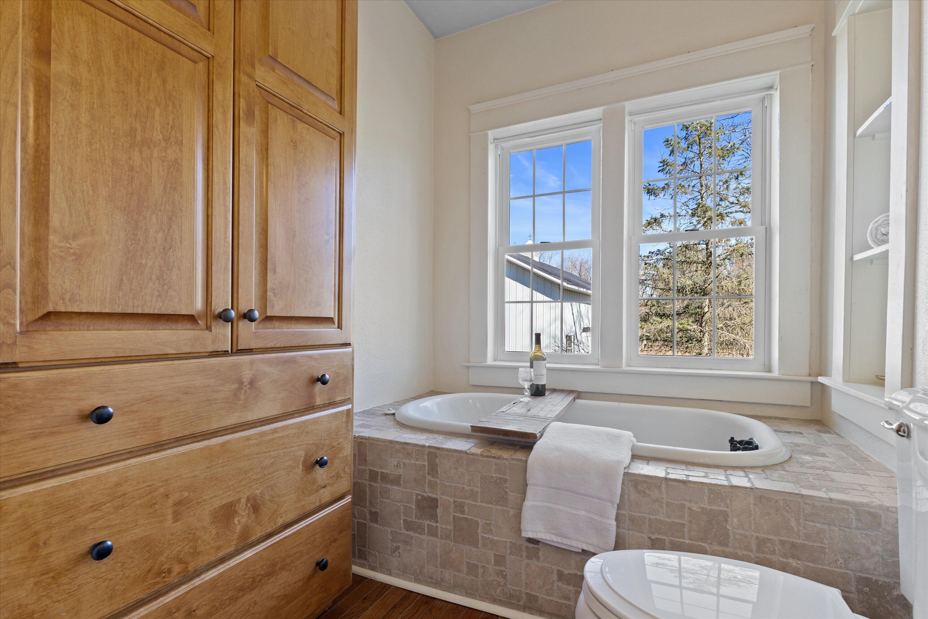 S38W31902 Wern Way Genesee, WI 53189 - Photo 16 of 67 Main floor full bath with original antique tub