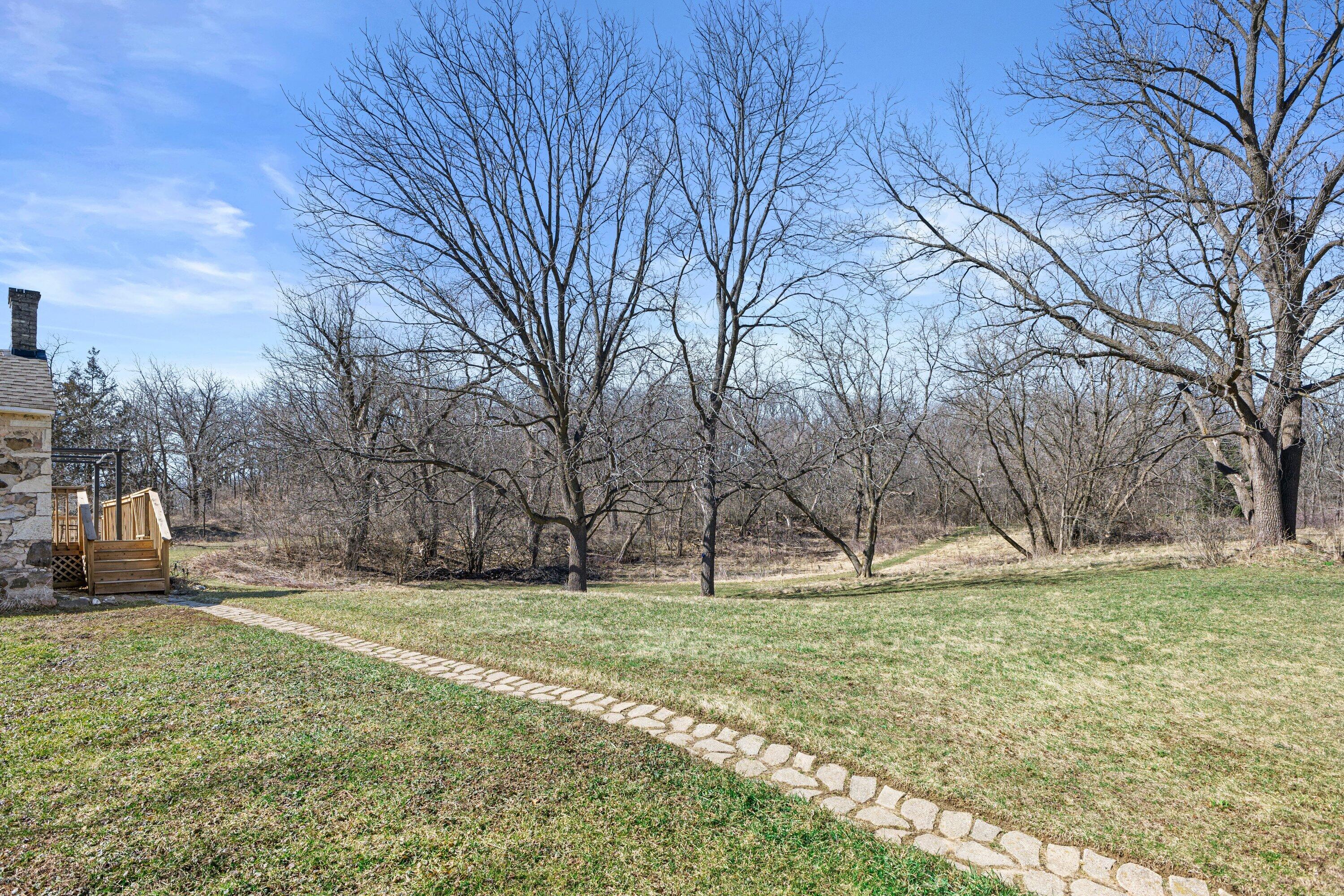S38W31902 Wern Way Genesee, WI 53189 - Photo 35 of 67 back yard with forested areas and trails