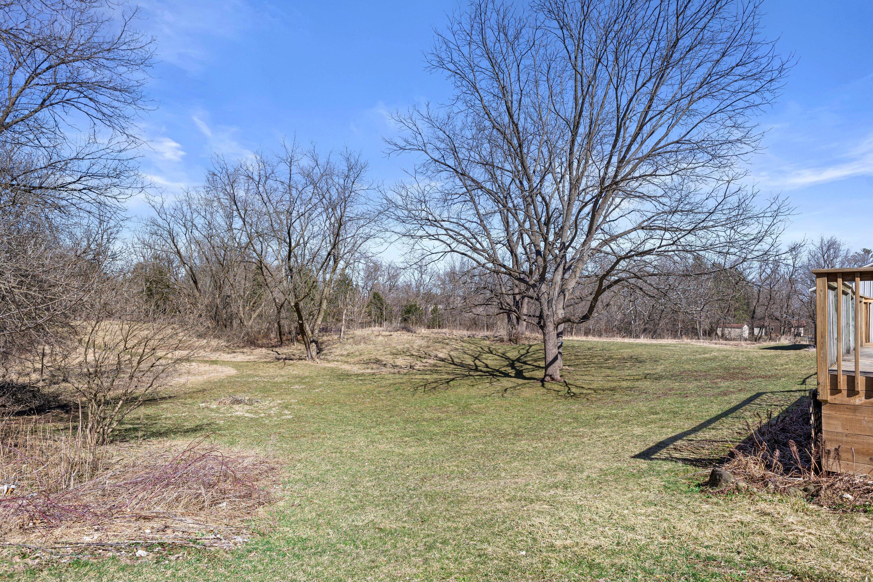S38W31902 Wern Way Genesee, WI 53189 - Photo 36 of 67 backyard with trees and trails