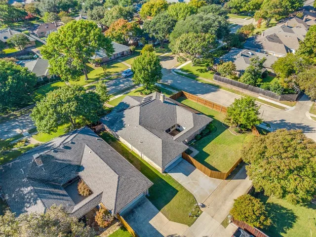 an aerial view of house with a yard
