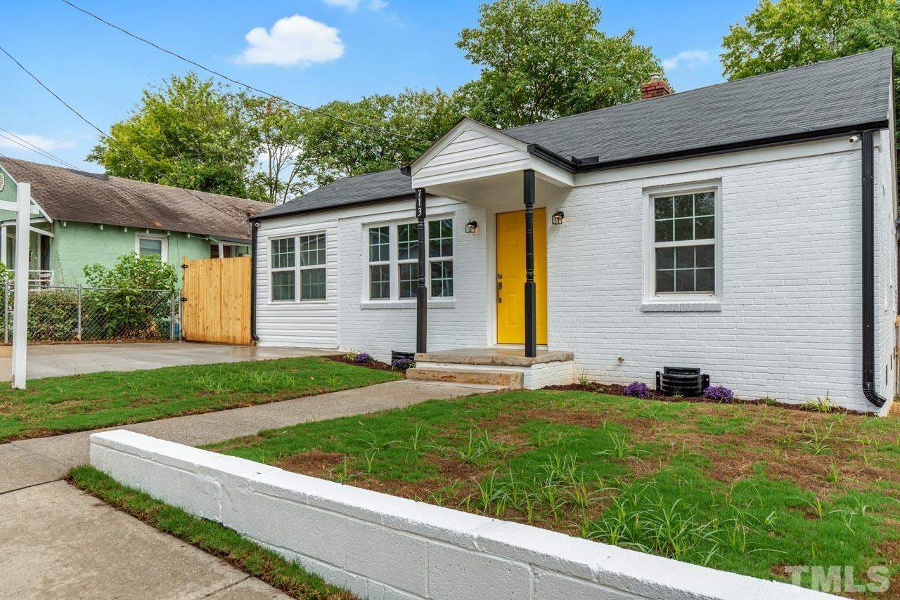 713 Quarry Street Raleigh, NC 27601 - Photo 2 of 26 a front view of a house with a yard