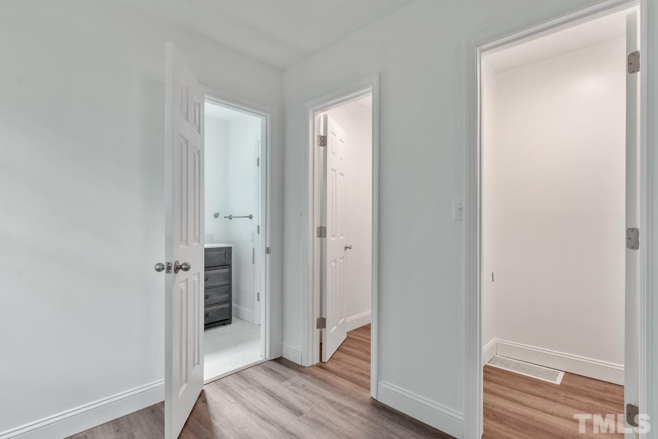 713 Quarry Street Raleigh, NC 27601 - Photo 18 of 26 a view of a hallway with wooden floor