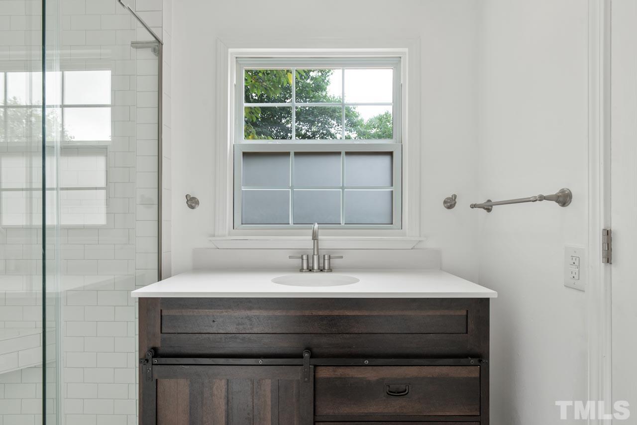 713 Quarry Street Raleigh, NC 27601 - Photo 19 of 26 a sink with a mirror