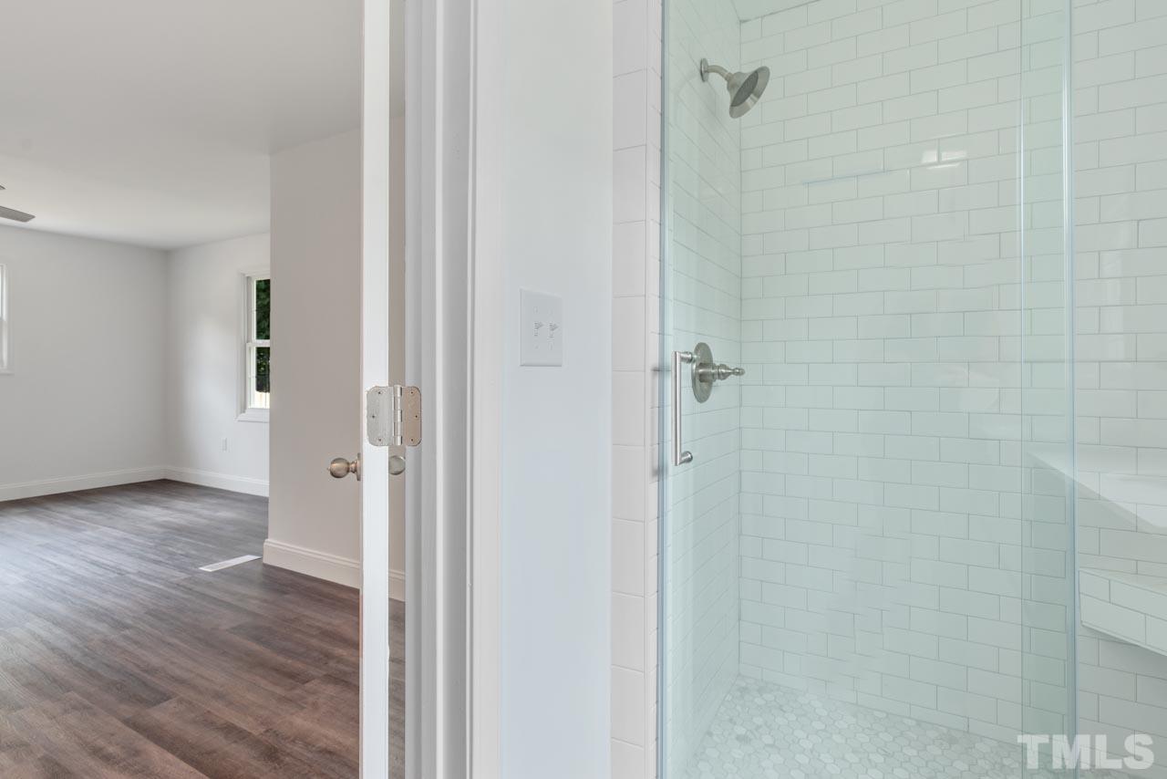 713 Quarry Street Raleigh, NC 27601 - Photo 20 of 26 a view of a bathroom from a hallway