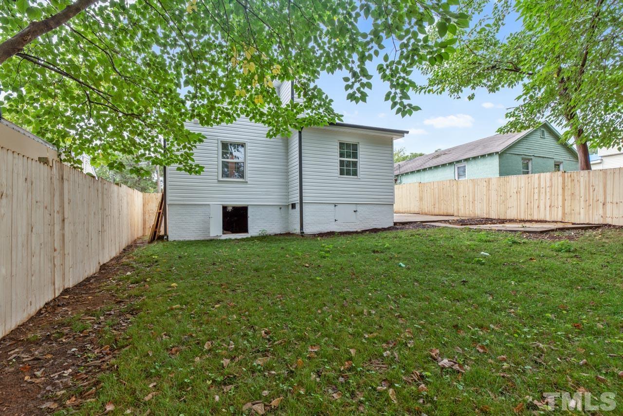713 Quarry Street Raleigh, NC 27601 - Photo 23 of 26 a house view with a garden space