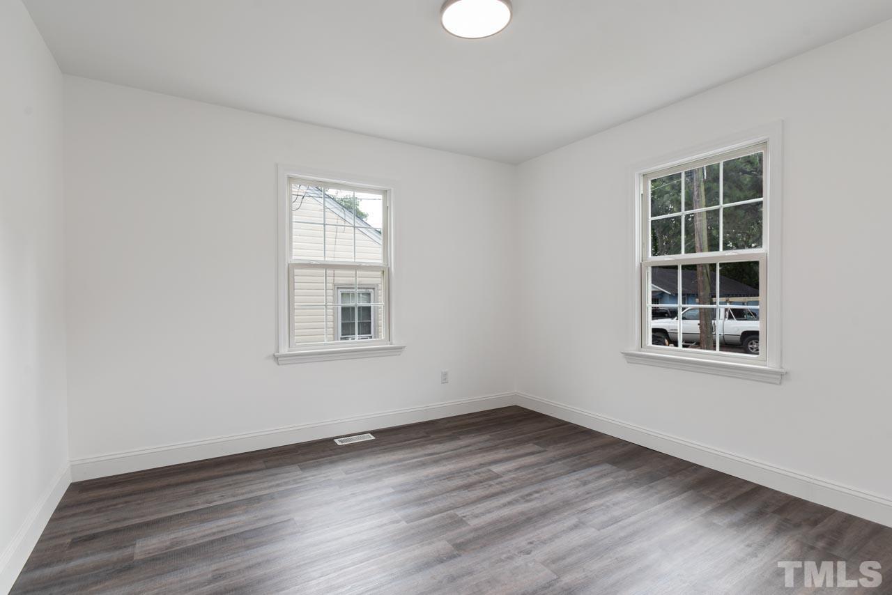 713 Quarry Street Raleigh, NC 27601 - Photo 6 of 26 an empty room with a window