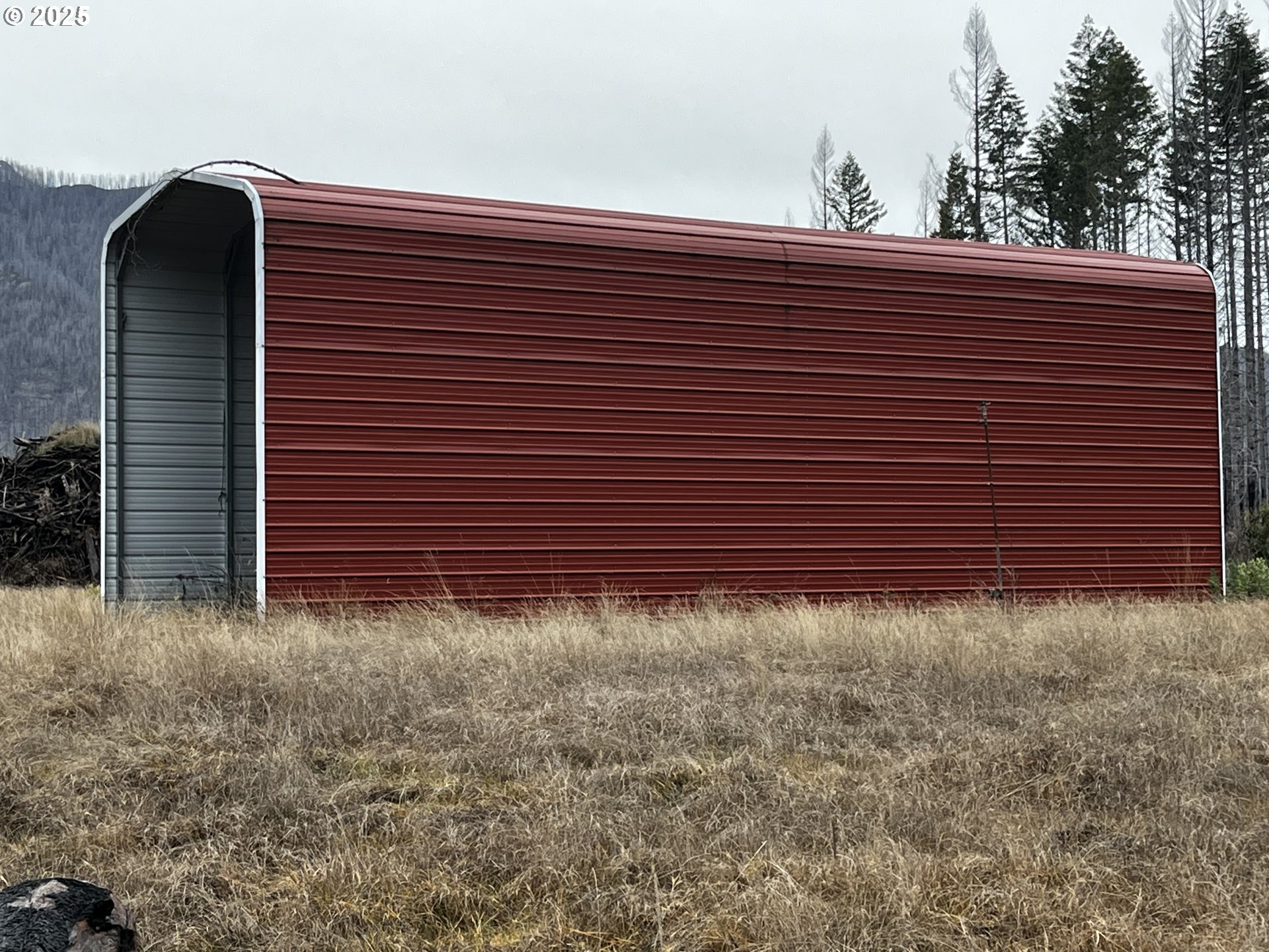 91737 Old Scout Road Blue River, OR 97413 - Photo 13 of 15 a view of a pathway with a wall in front of the house