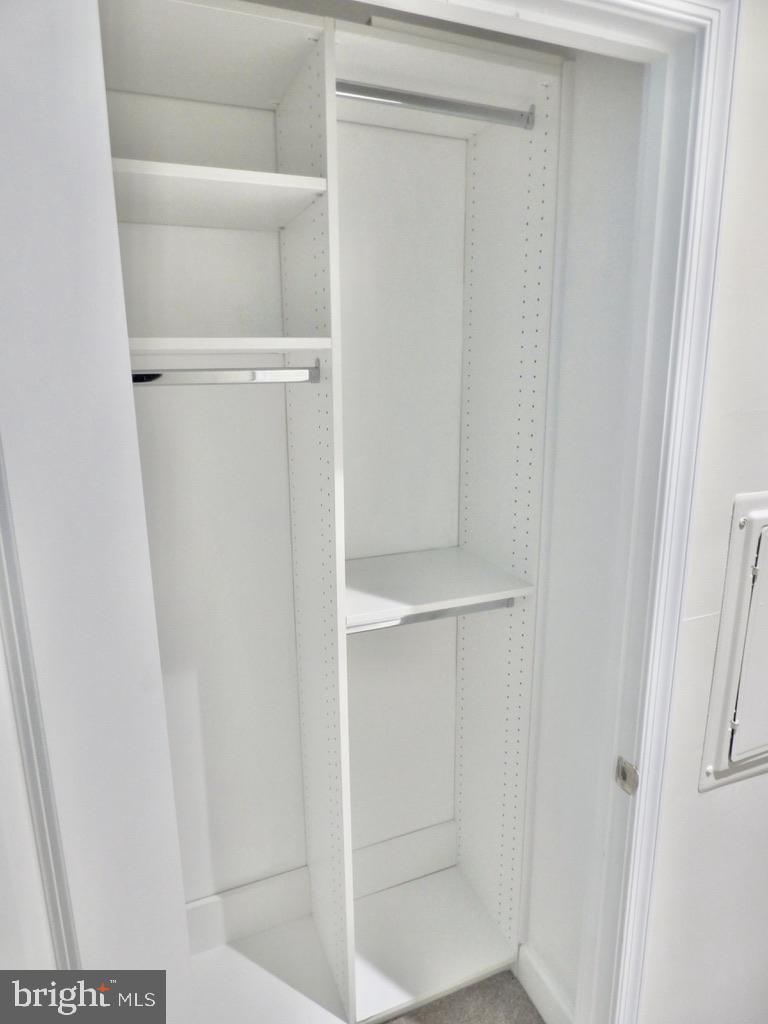 11800 Sunset Hills Road, Unit 118 Reston, VA 20190 - Photo 25 of 52 Sleek, organized closet space awaits.