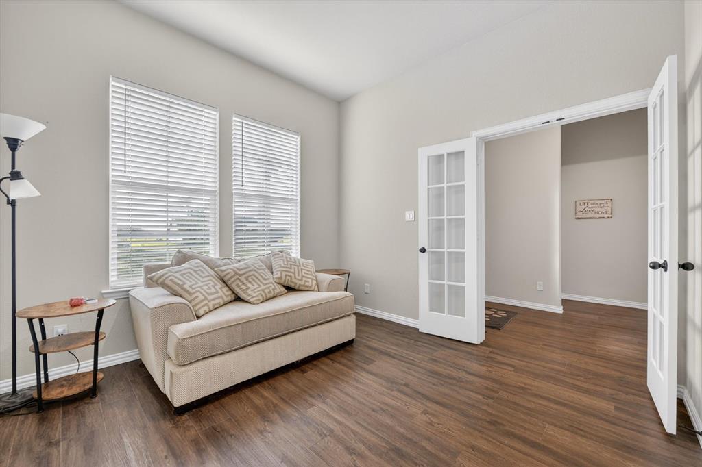 150 Chester Road Springtown, TX 76082 - Photo 21 of 40 a living room with furniture and a large window