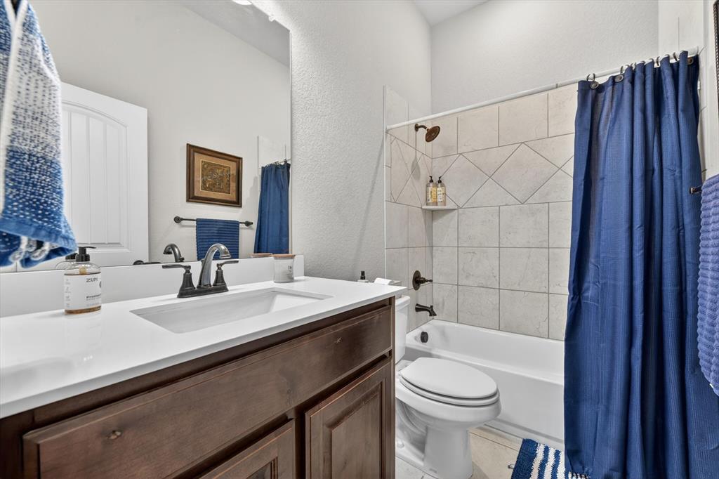 150 Chester Road Springtown, TX 76082 - Photo 27 of 40 a bathroom with a sink a toilet and shower