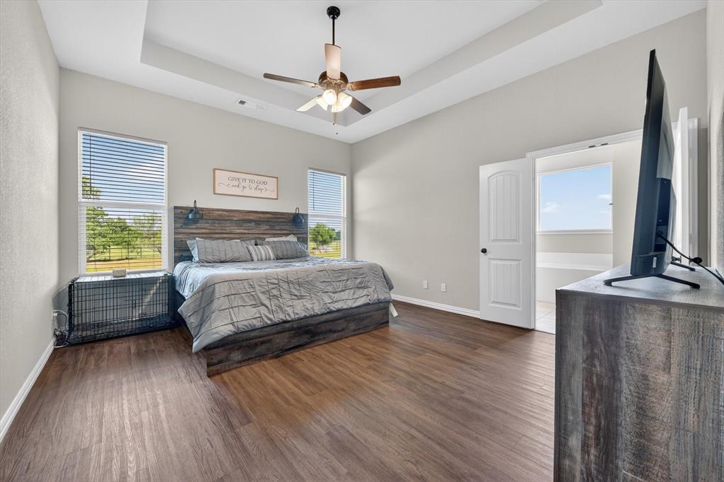 150 Chester Road Springtown, TX 76082 - Photo 28 of 40 a bedroom with a bed window and a mirror