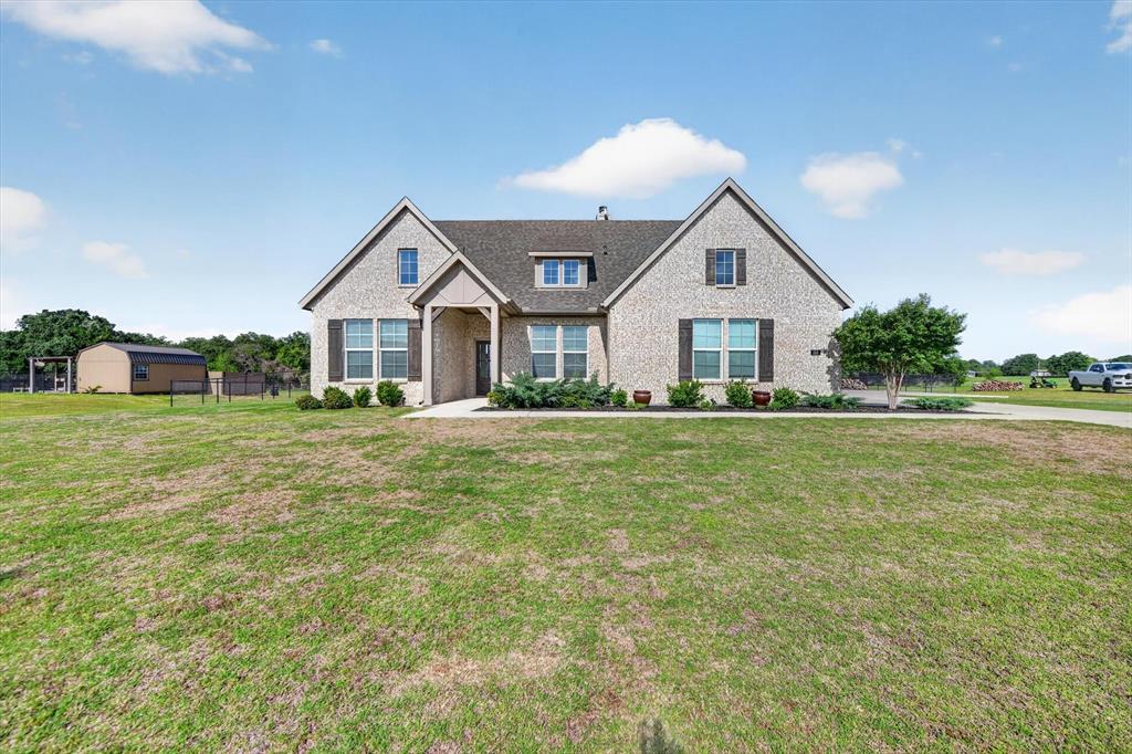 150 Chester Road Springtown, TX 76082 - Photo 3 of 40 a front view of house with yard and green space