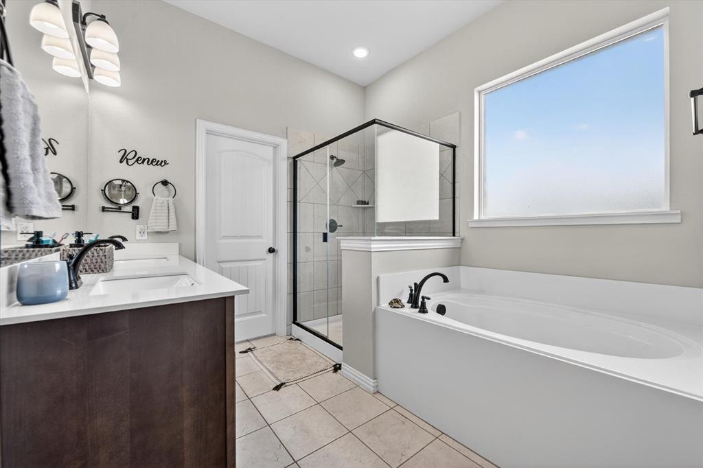 150 Chester Road Springtown, TX 76082 - Photo 31 of 40 a white bath tub sitting next to a bathroom sink