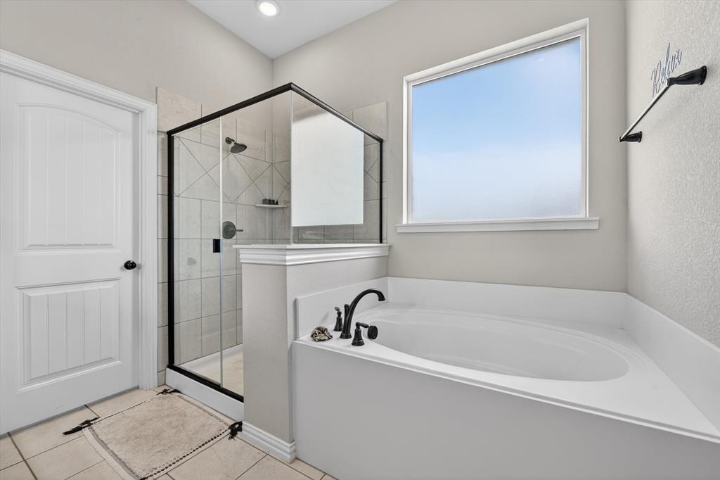 150 Chester Road Springtown, TX 76082 - Photo 32 of 40 a white bath tub sitting next to a shower