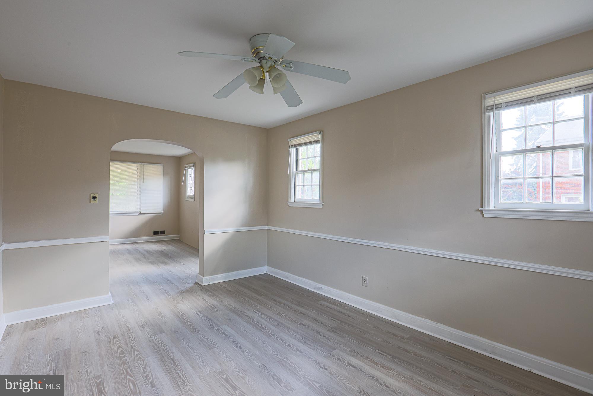 3914 Bancroft Road Baltimore, MD 21215 - Photo 10 of 25 a view of empty room with wooden floor and fan