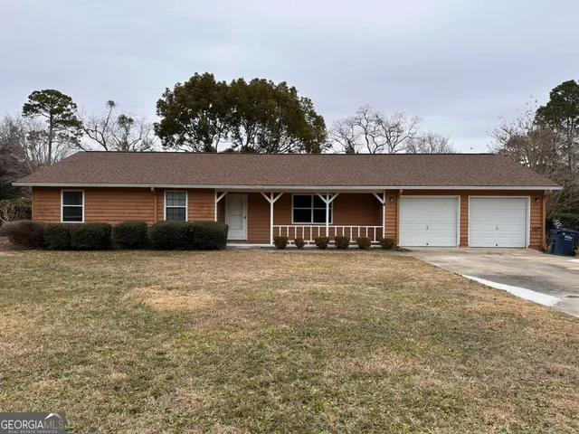 front view of a house with a big yard