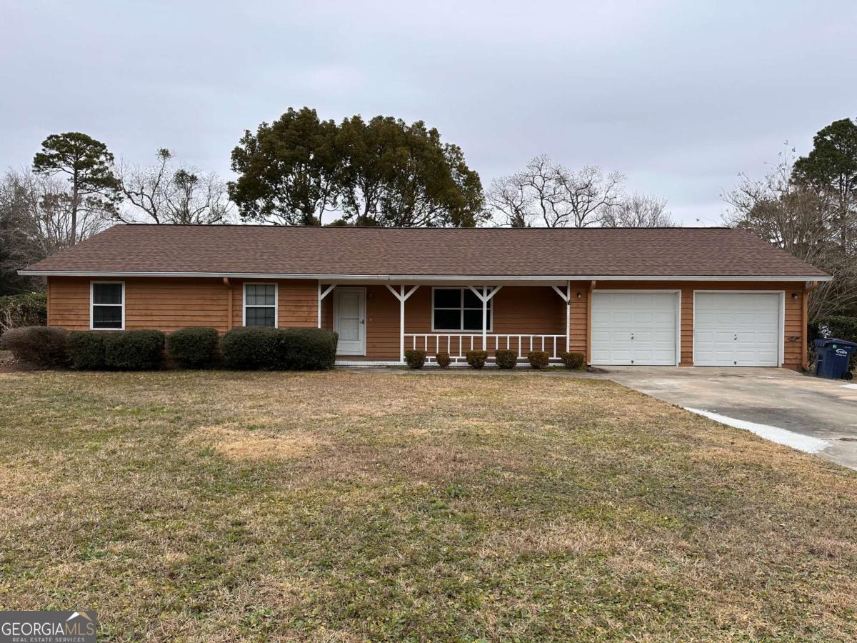 front view of a house with a big yard