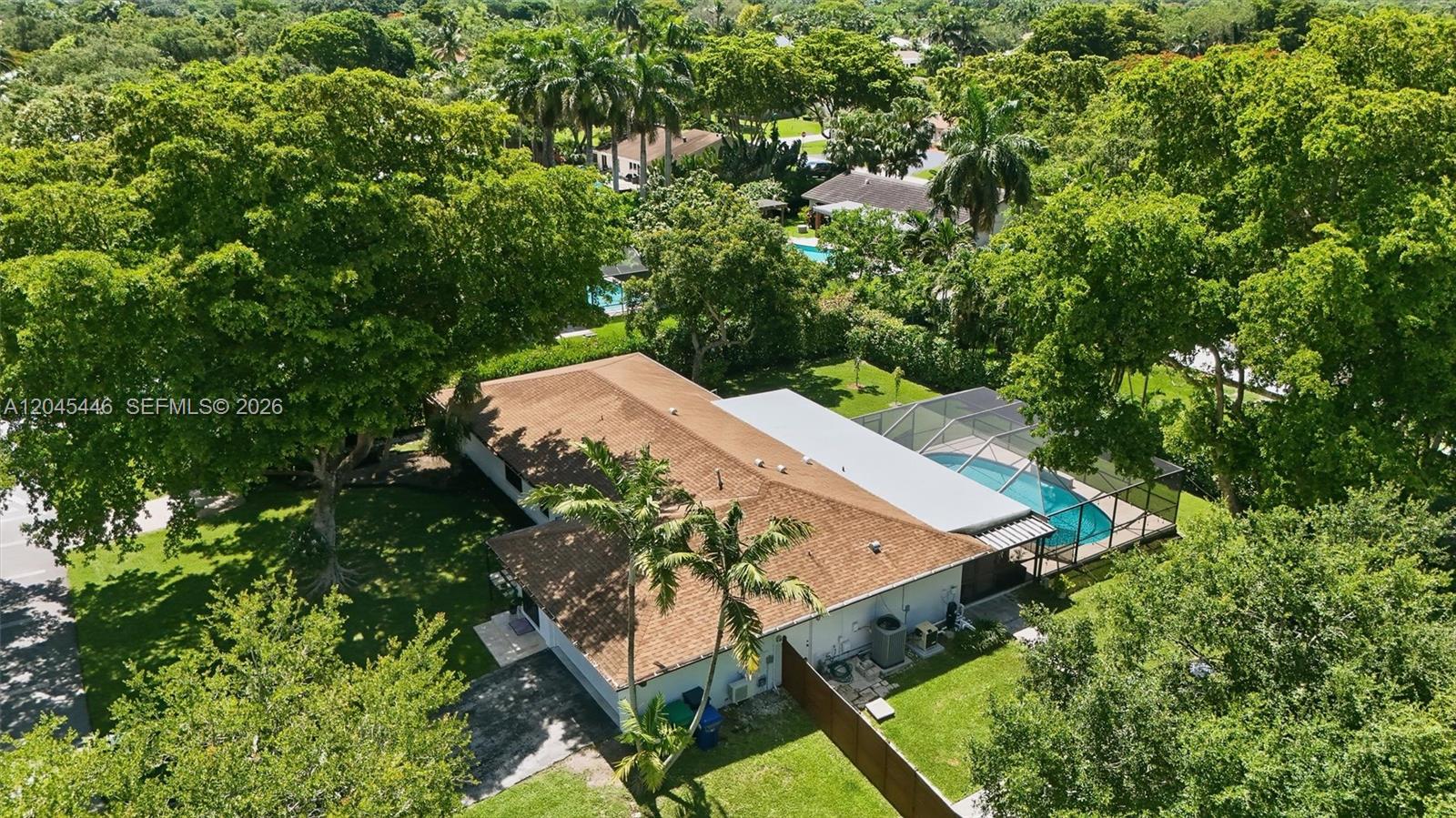 8440 Southwest 180th Street Palmetto Bay, FL 33157 - Photo 49 of 54 an aerial view of a house with yard